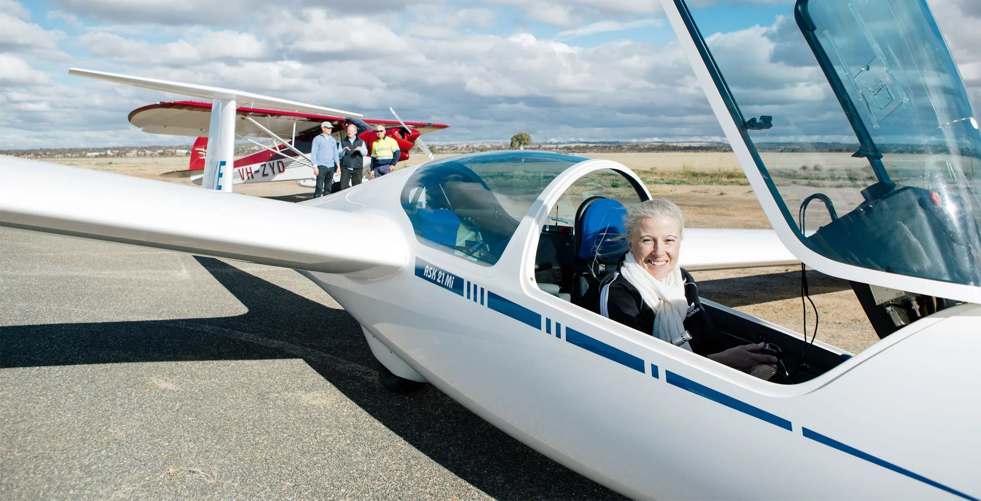 A beaming passenger in the front cockpit of SoarAbility's glider just after landing at Cunderdin